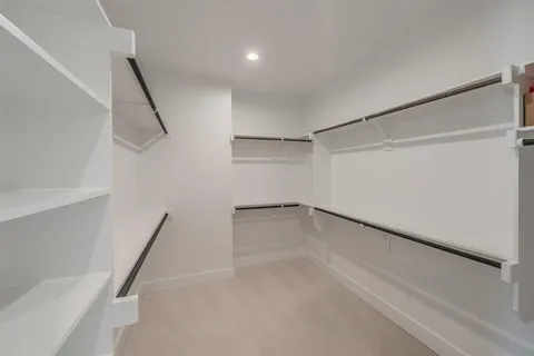 a view of an empty walk in closet