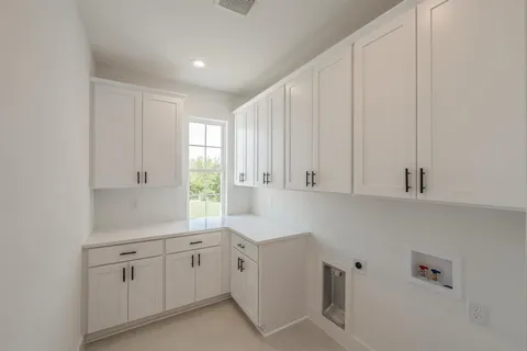 a view of cabinets and window