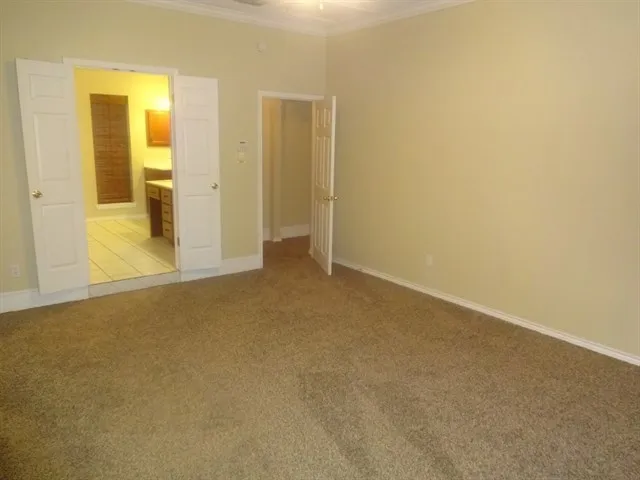 an empty room with a bathroom