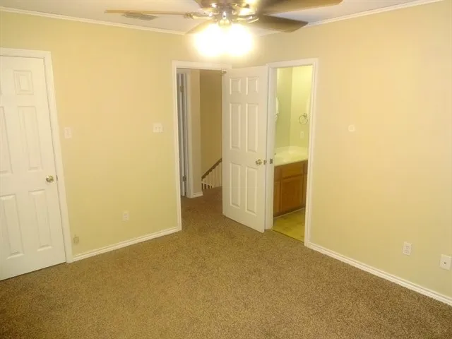 an empty room with a bathroom