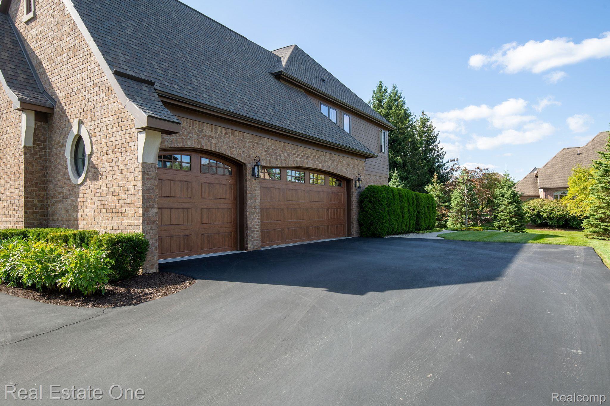 3760 Cedar Brook Drive Rochester, MI 48309 - Photo 63 of 76 3 Car Side Entrance Garage with Bend Pak Car Hoist