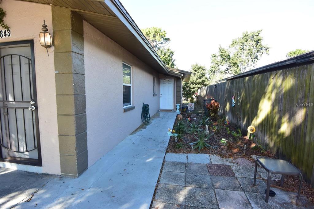 5845 Elm Street New Port Richey, FL 34652 - Photo 4 of 13 a view of a pathway of a house