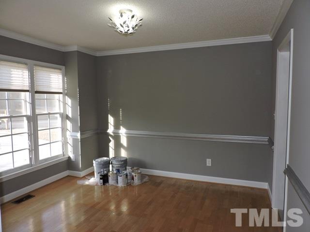 4325 Willow Lake Road Raleigh, NC 27616 - Photo 11 of 25 a view of empty room with a window and chandelier