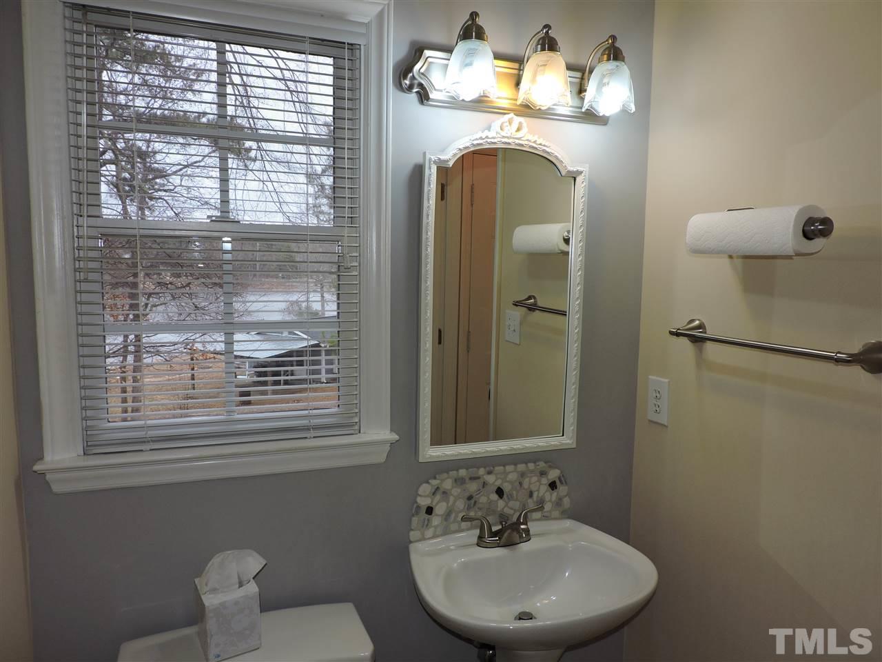 4325 Willow Lake Road Raleigh, NC 27616 - Photo 13 of 25 a bathroom with a toilet sink and mirror