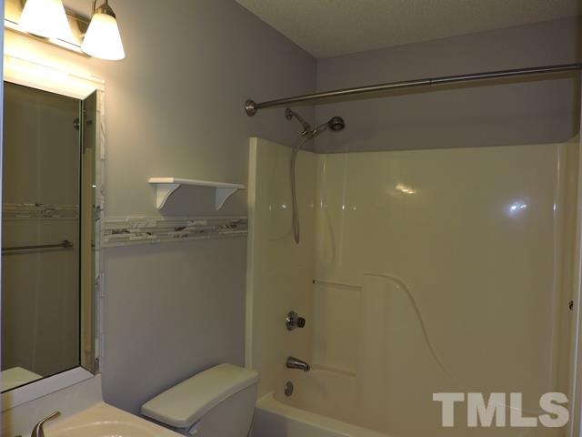 4325 Willow Lake Road Raleigh, NC 27616 - Photo 17 of 25 a bathroom with a shower and a toilet