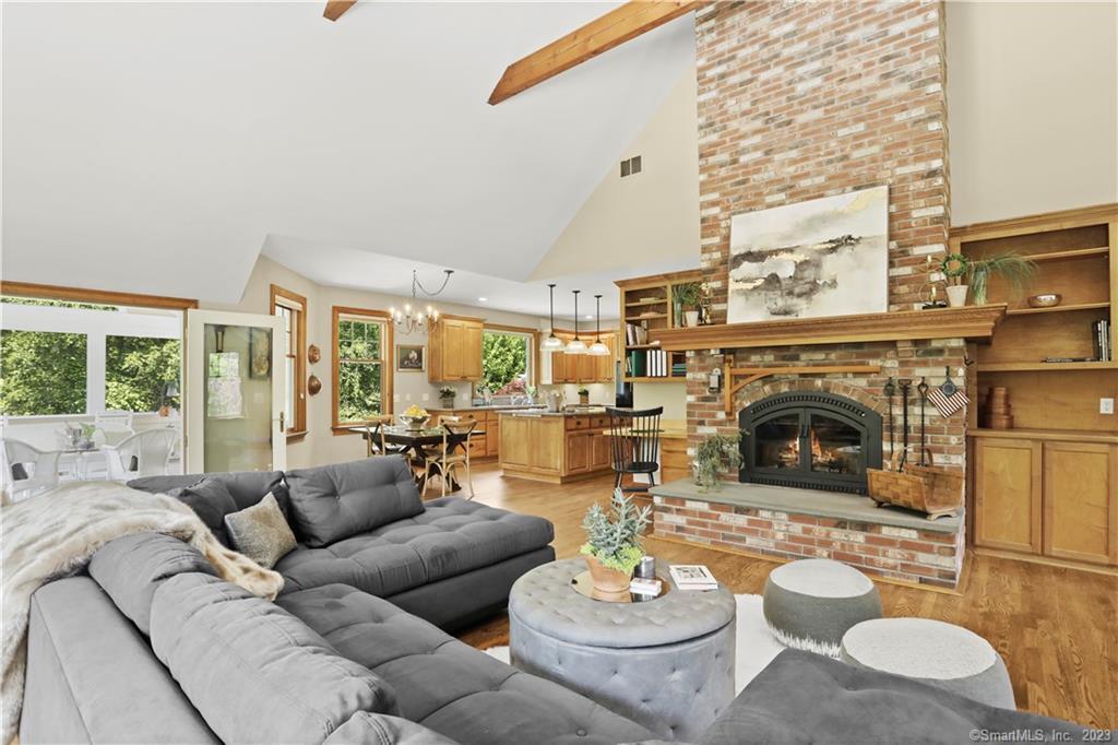 12 North Calvin Road Weston, CT 06883 - Photo 1 of 1 a living room with furniture and a fireplace