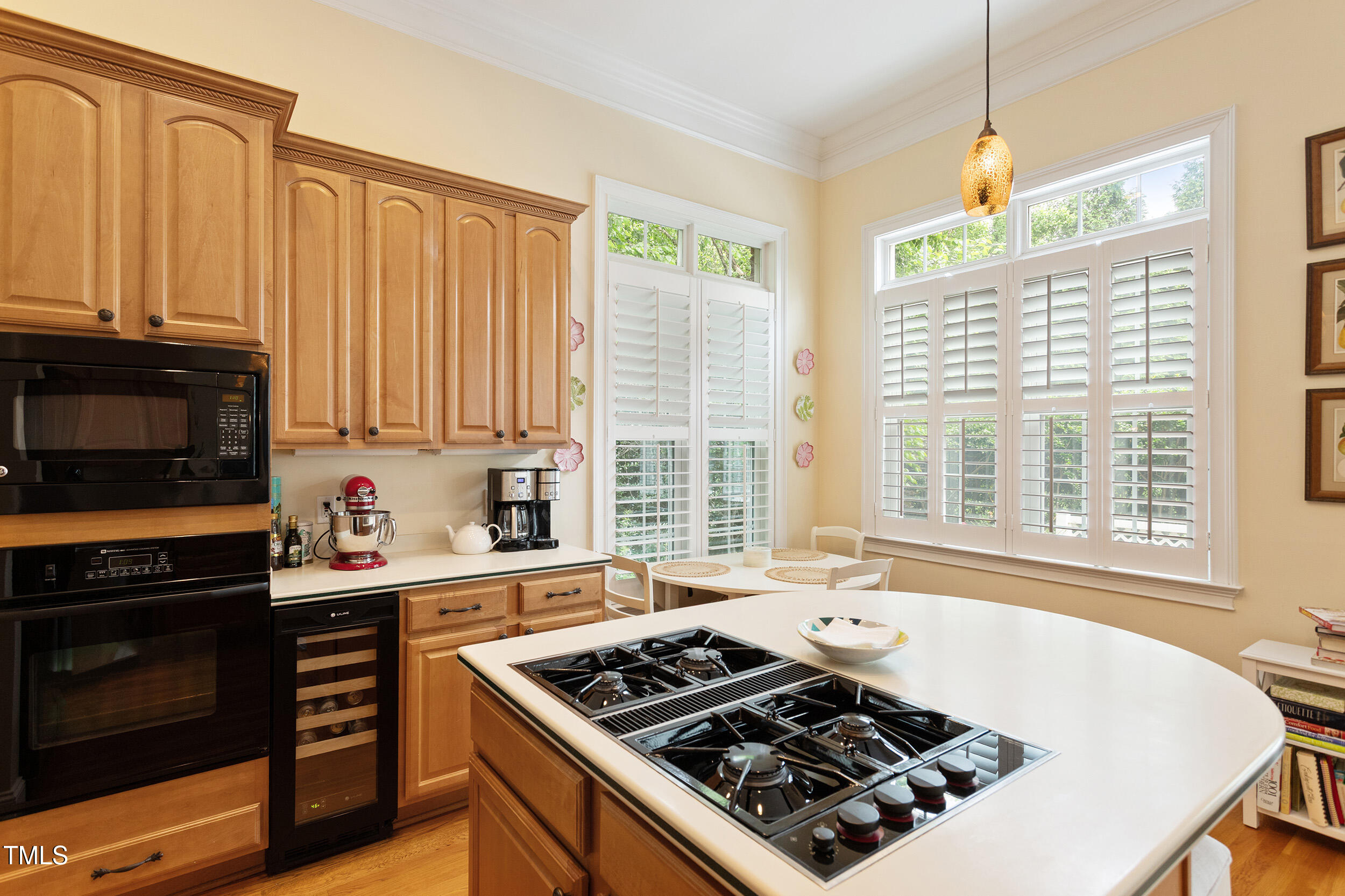 3928 Bentley Bridge Road Raleigh, NC 27612 - Photo 17 of 36 a kitchen with a stove a sink and a microwave