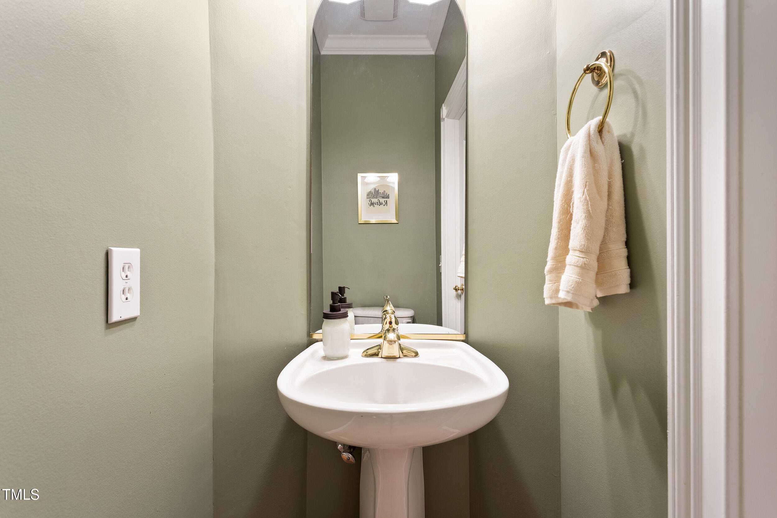 3928 Bentley Bridge Road Raleigh, NC 27612 - Photo 18 of 36 a bathroom with a sink and a mirror