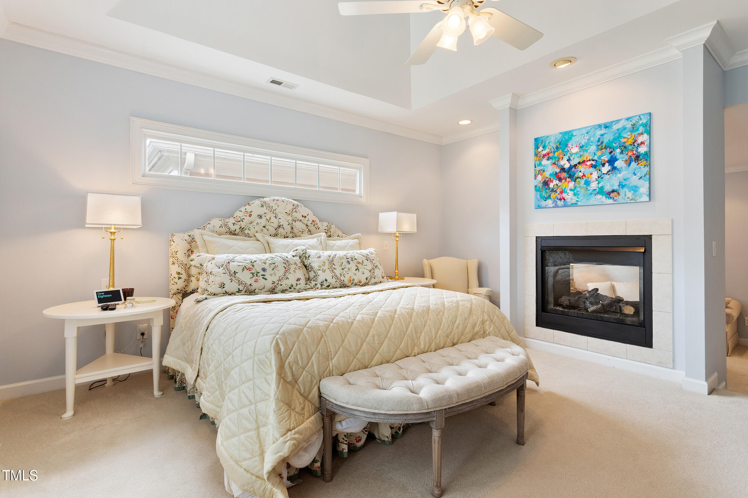 3928 Bentley Bridge Road Raleigh, NC 27612 - Photo 20 of 36 a bedroom with a bed and a fireplace