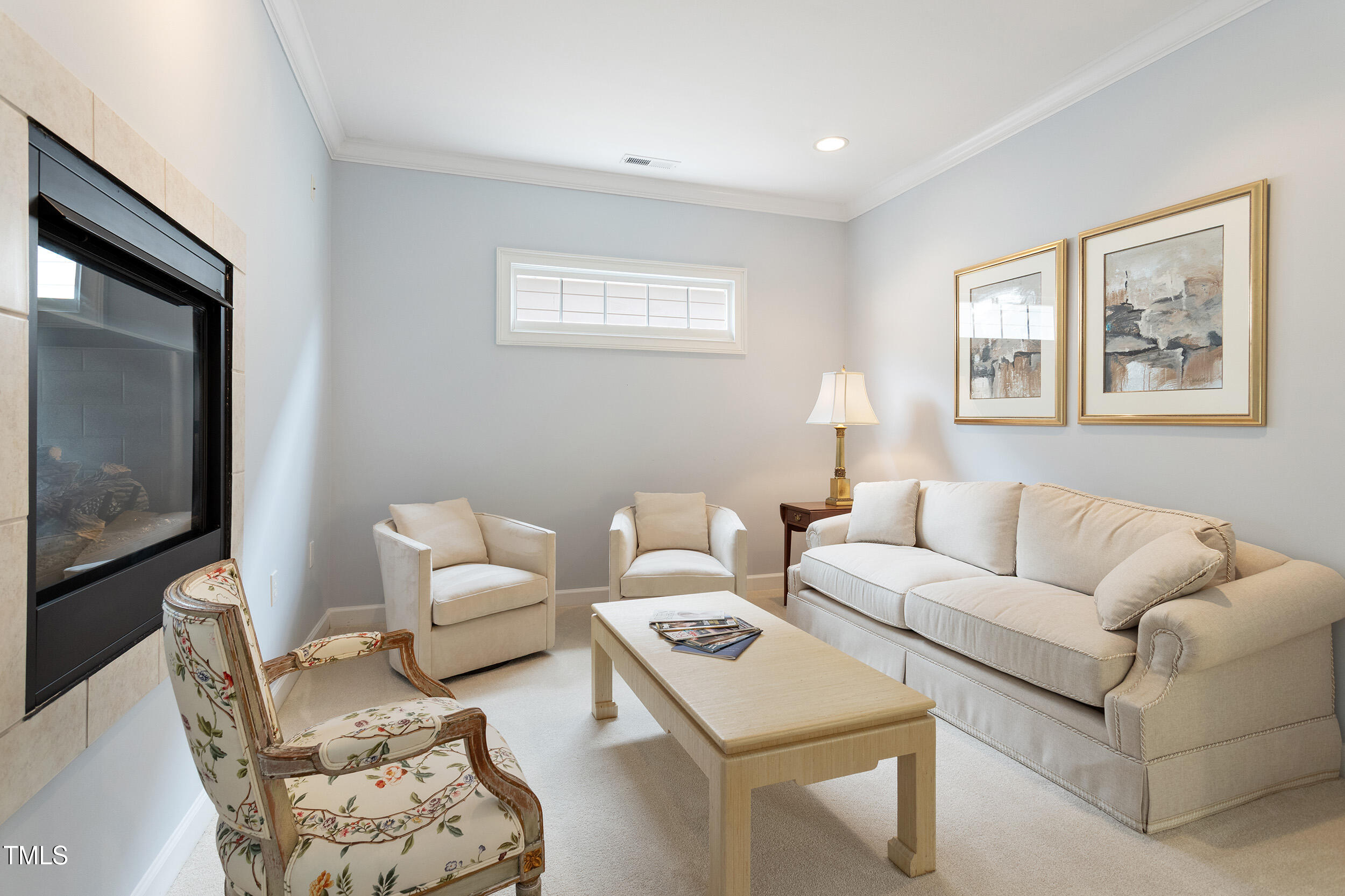 3928 Bentley Bridge Road Raleigh, NC 27612 - Photo 22 of 36 a living room with furniture and a flat screen tv