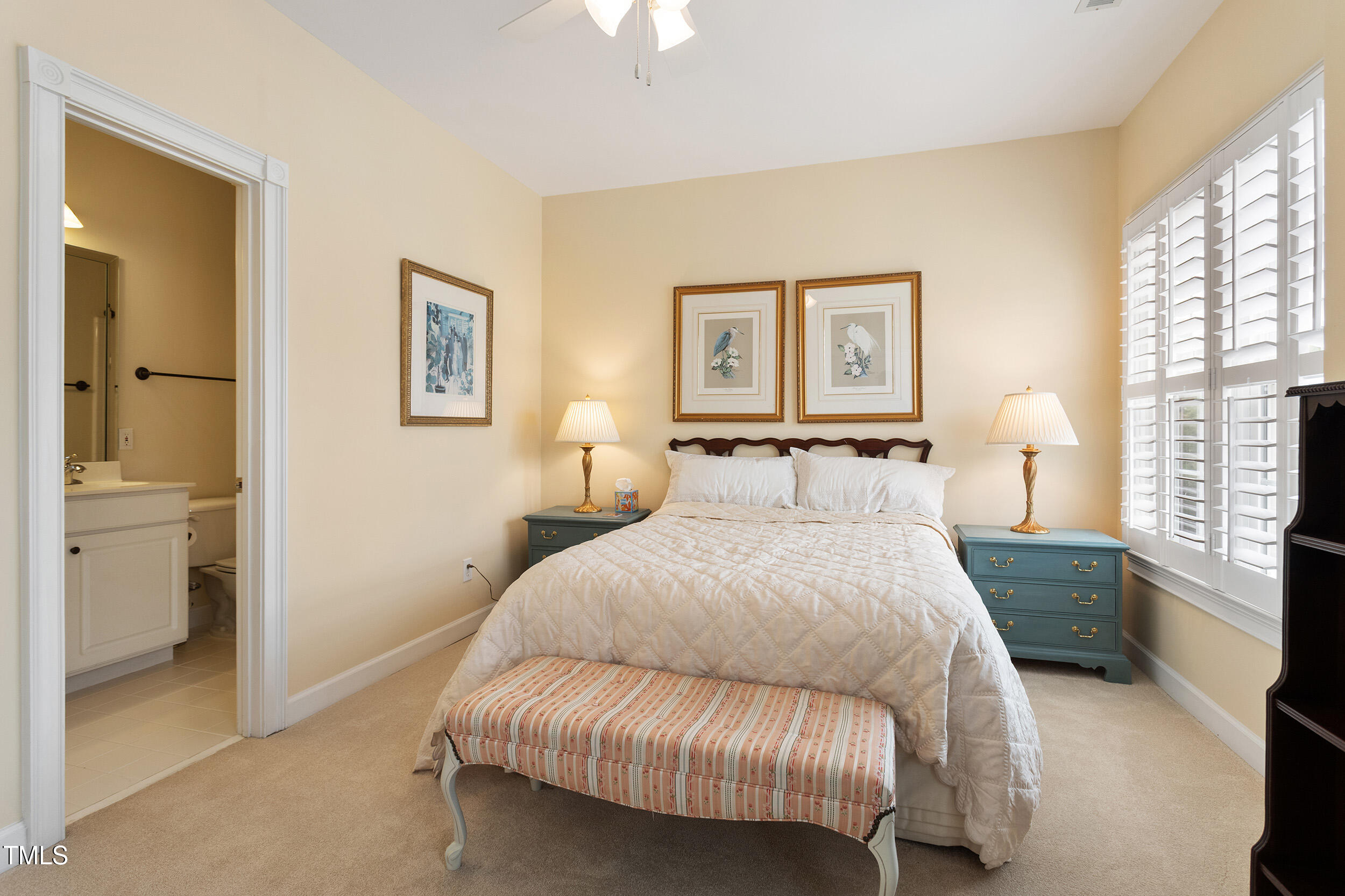 3928 Bentley Bridge Road Raleigh, NC 27612 - Photo 27 of 36 a spacious bedroom with a bed and a couch