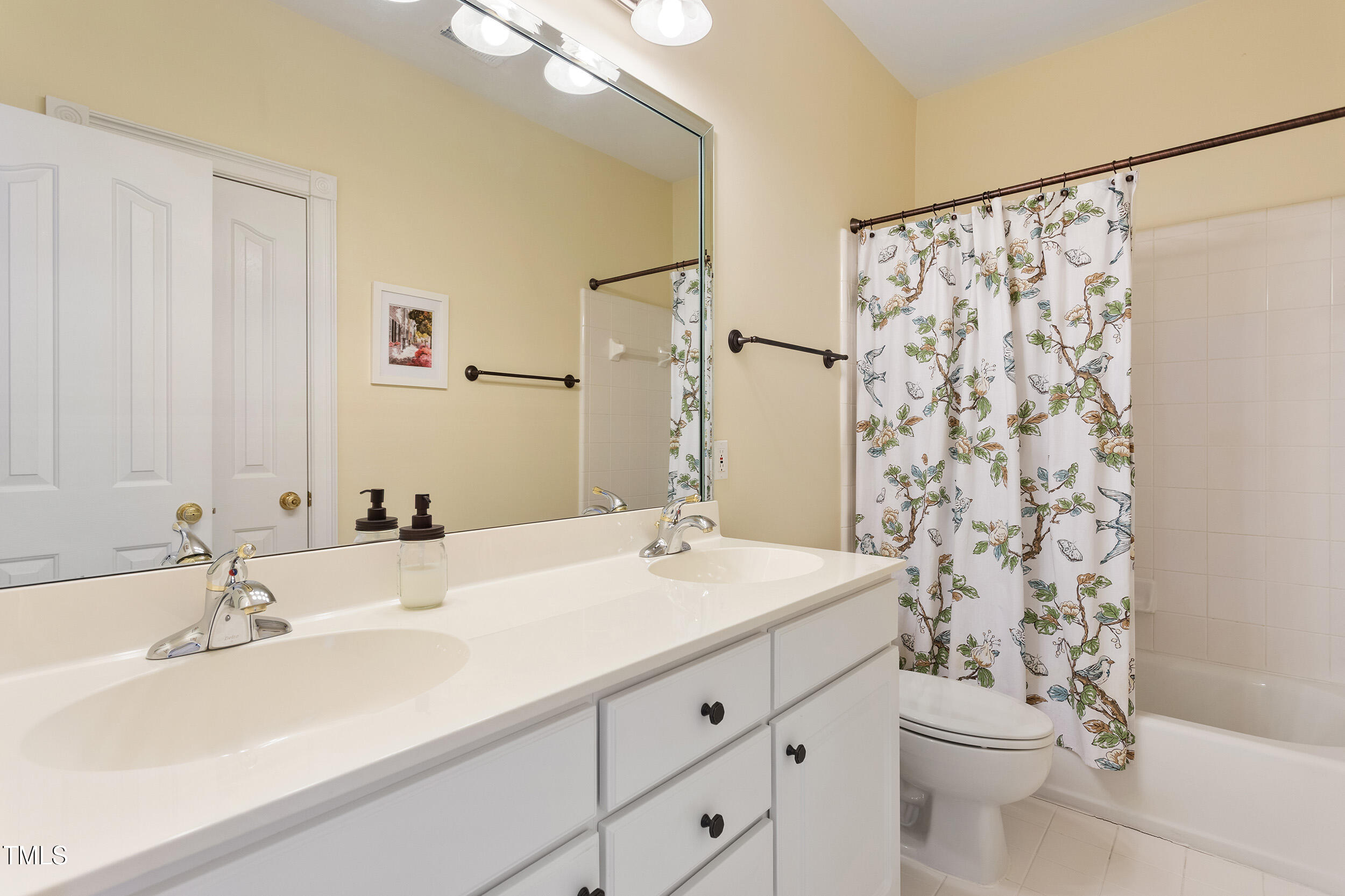 3928 Bentley Bridge Road Raleigh, NC 27612 - Photo 28 of 36 a bathroom with a sink and a mirror