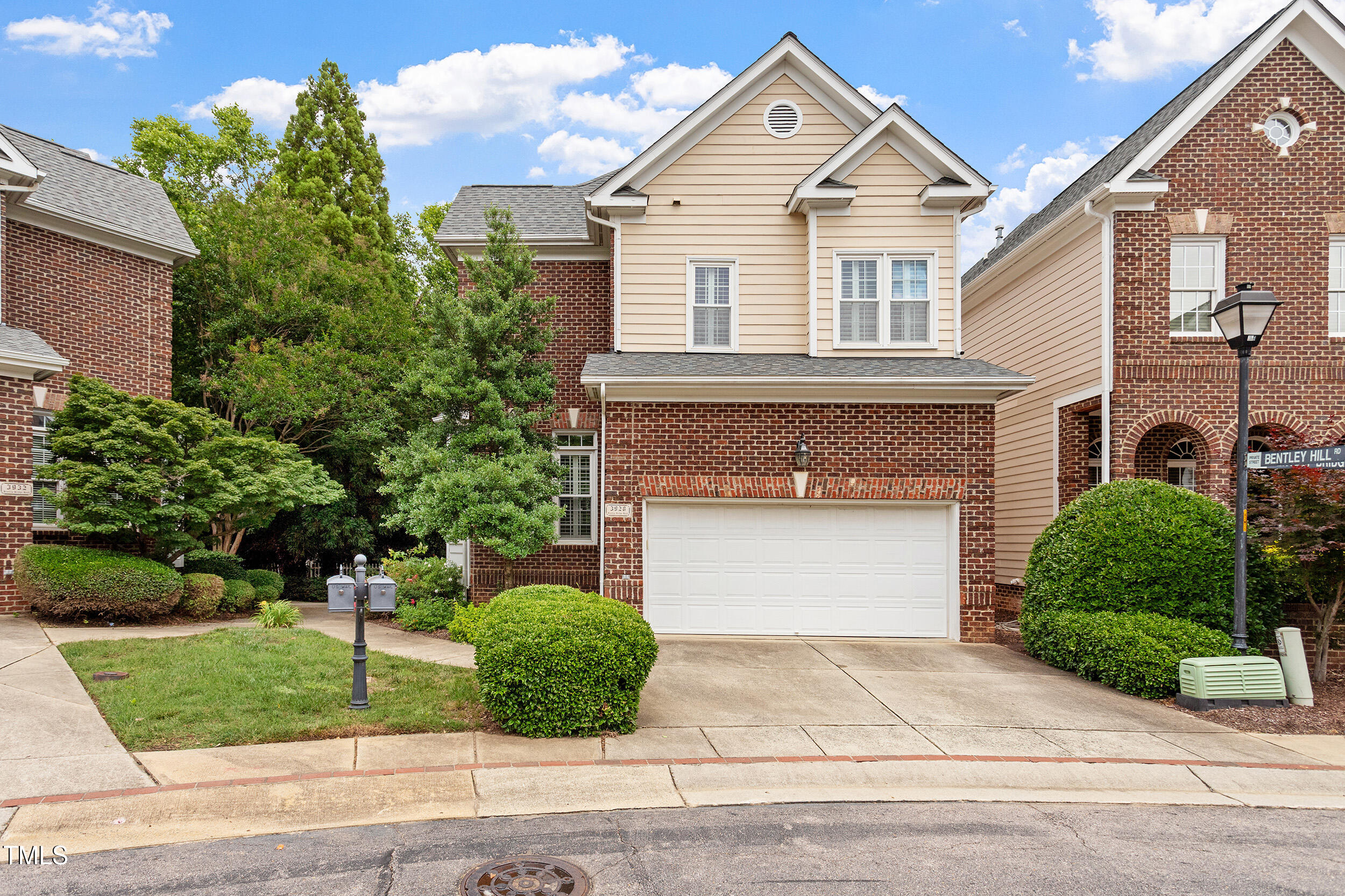 3928 Bentley Bridge Road Raleigh, NC 27612 - Photo 35 of 36 a front view of a house with a yard and garage