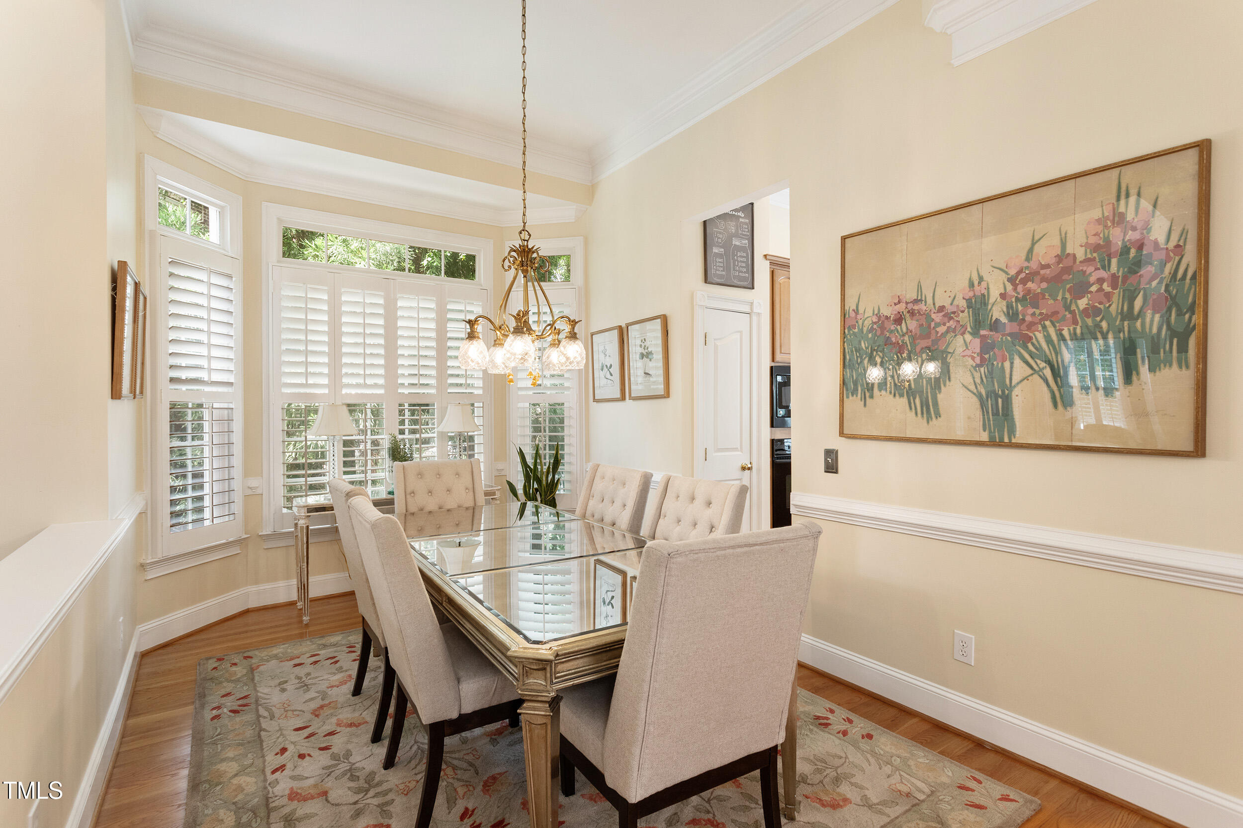 3928 Bentley Bridge Road Raleigh, NC 27612 - Photo 9 of 36 a view of a dining room with furniture window and outside view