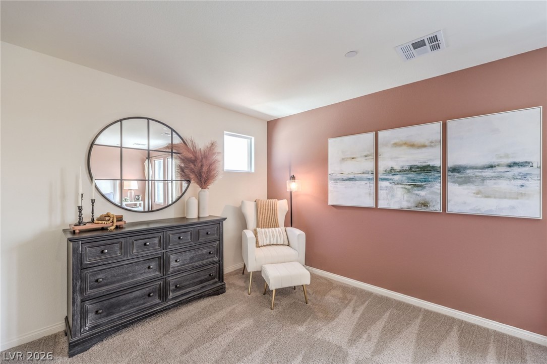 1017 Copper Robin Street Henderson, NV 89011 - Photo 22 of 43 Photo is representational only; actual home finishes may vary. Sitting room with carpet flooring and baseboards