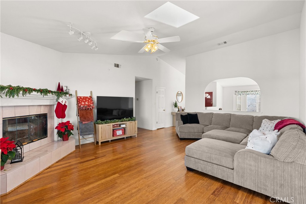 781 Koval Lane Santa Maria, CA 93455 - Photo 11 of 33 a living room with furniture a flat screen tv and a fireplace