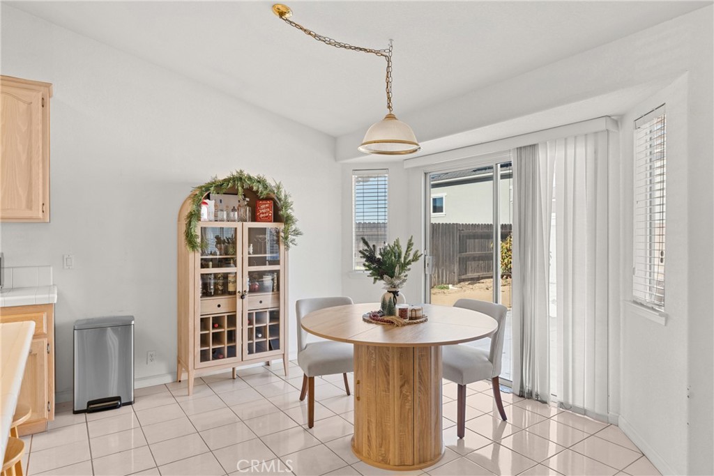 781 Koval Lane Santa Maria, CA 93455 - Photo 12 of 33 a view of a dining room with furniture window and wooden floor