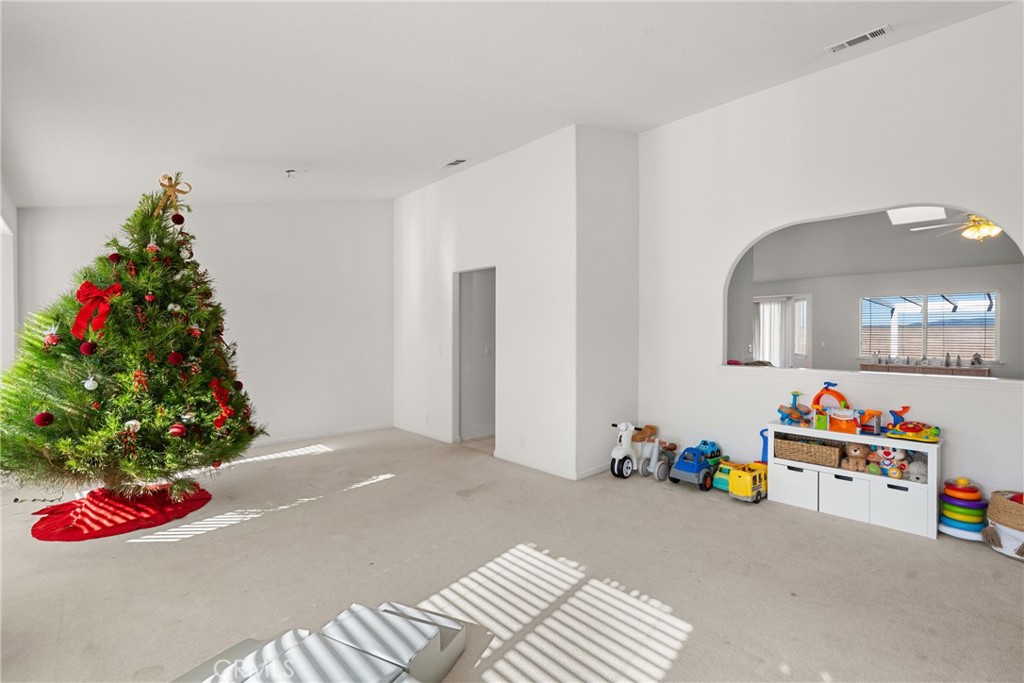 781 Koval Lane Santa Maria, CA 93455 - Photo 4 of 33 a bedroom with furniture and a potted plant