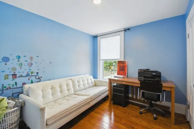 a bedroom with a bed and flat screen tv