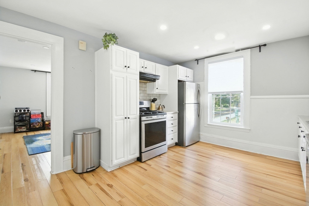 35 Locust Street, Unit 3 Danvers, MA 01923 - Photo 12 of 42 a kitchen with stainless steel appliances a refrigerator and a stove top oven