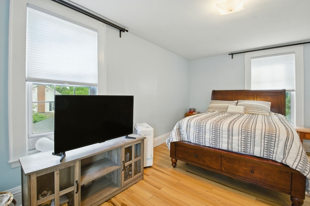 35 Locust Street, Unit 3 Danvers, MA 01923 - Photo 14 of 42 a bedroom with a bed and flat screen tv