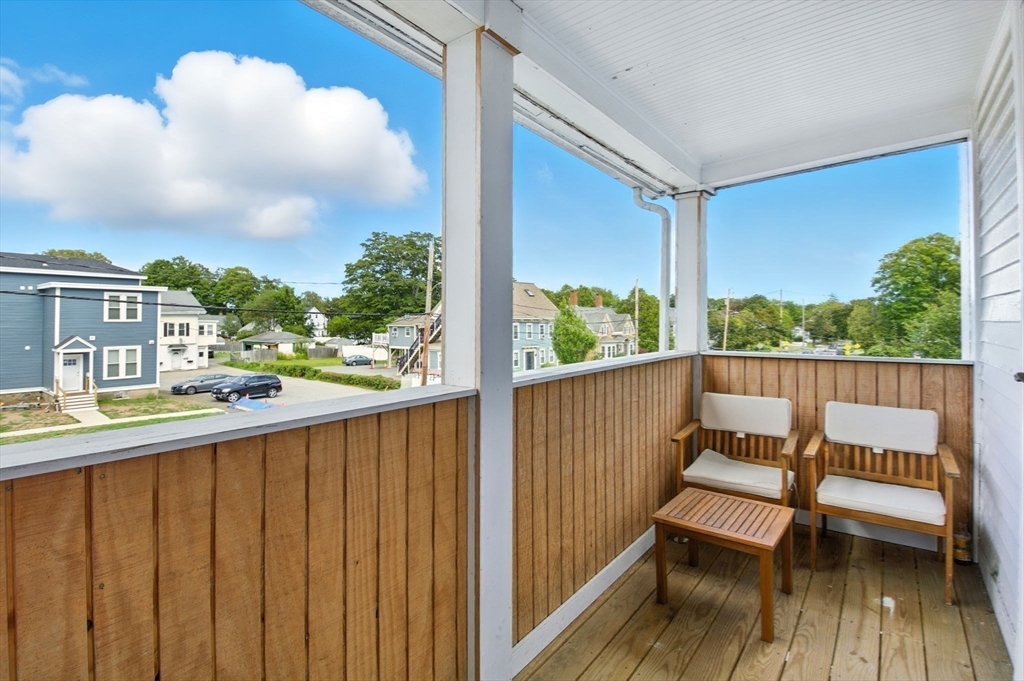 35 Locust Street, Unit 3 Danvers, MA 01923 - Photo 2 of 42 a view of a balcony with wooden floor