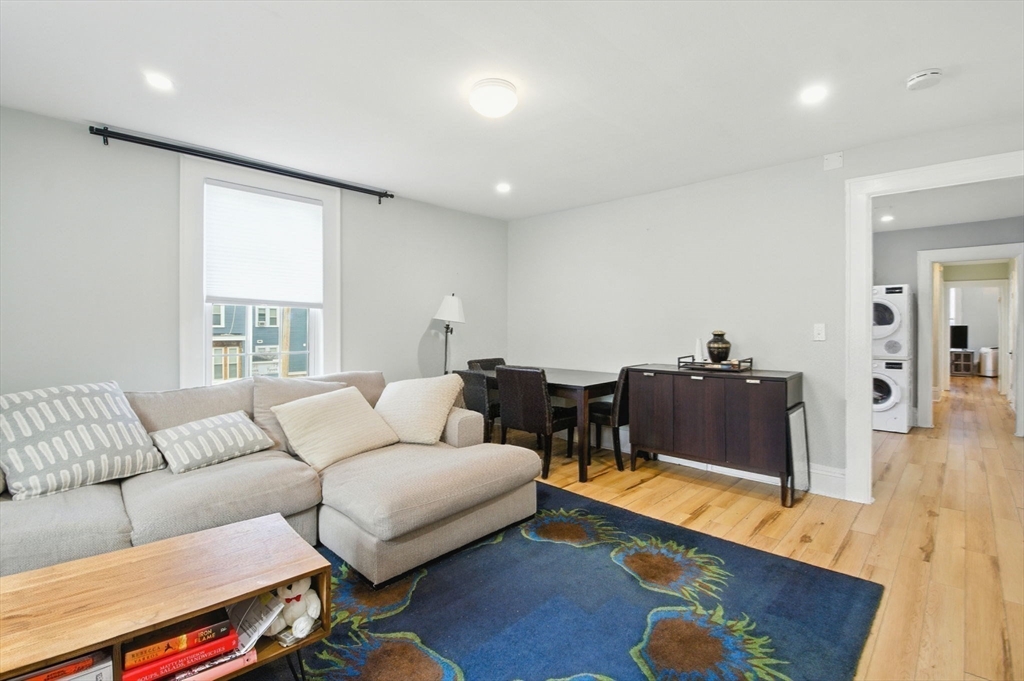 35 Locust Street, Unit 3 Danvers, MA 01923 - Photo 22 of 42 a living room with furniture and a couch