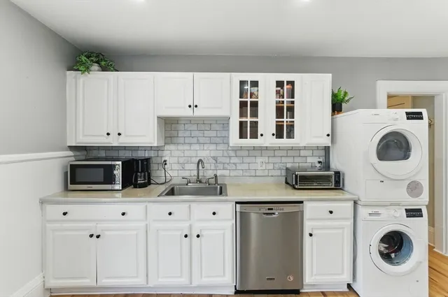 a view of a house with a yard porch and sitting area