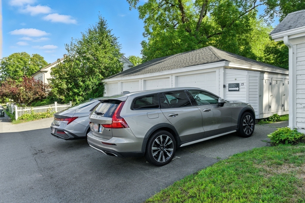 35 Locust Street, Unit 3 Danvers, MA 01923 - Photo 32 of 42 a view of a car in front of a house