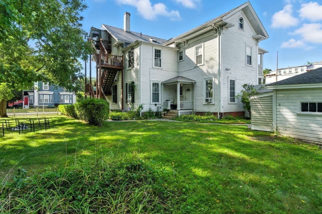 35 Locust Street, Unit 3 Danvers, MA 01923 - Photo 34 of 42 a front view of a house with garden