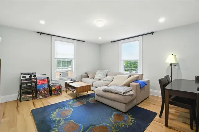 a kitchen with stainless steel appliances granite countertop a stove and white cabinets
