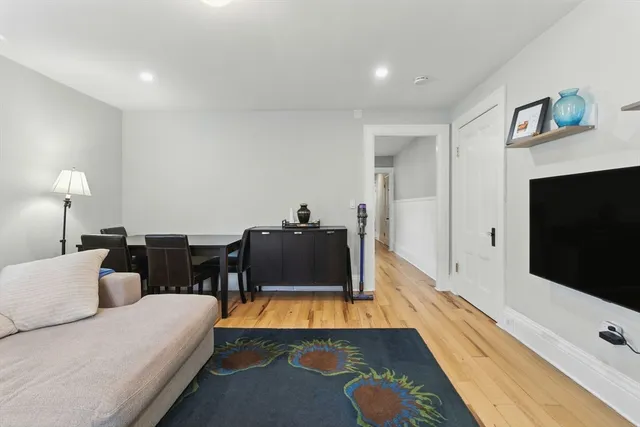 a car parked in front of white house