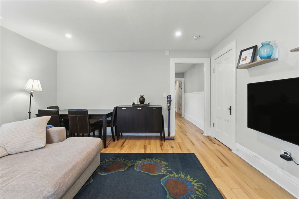 35 Locust Street, Unit 3 Danvers, MA 01923 - Photo 7 of 42 a living room with furniture and a flat screen tv