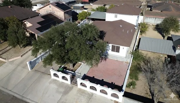 an aerial view of houses with outdoor space