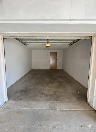 a view of an empty room with windows