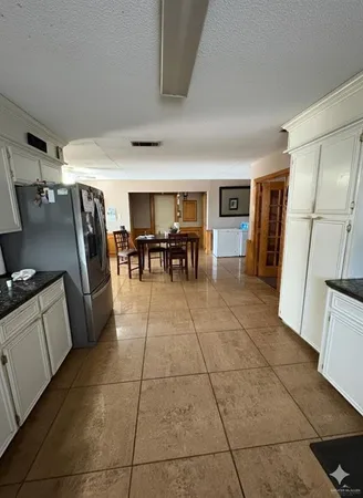 a view of an empty room and a window