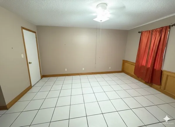 a view of a livingroom and a car parked in it