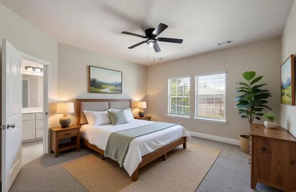 a bedroom with a bed couch and window