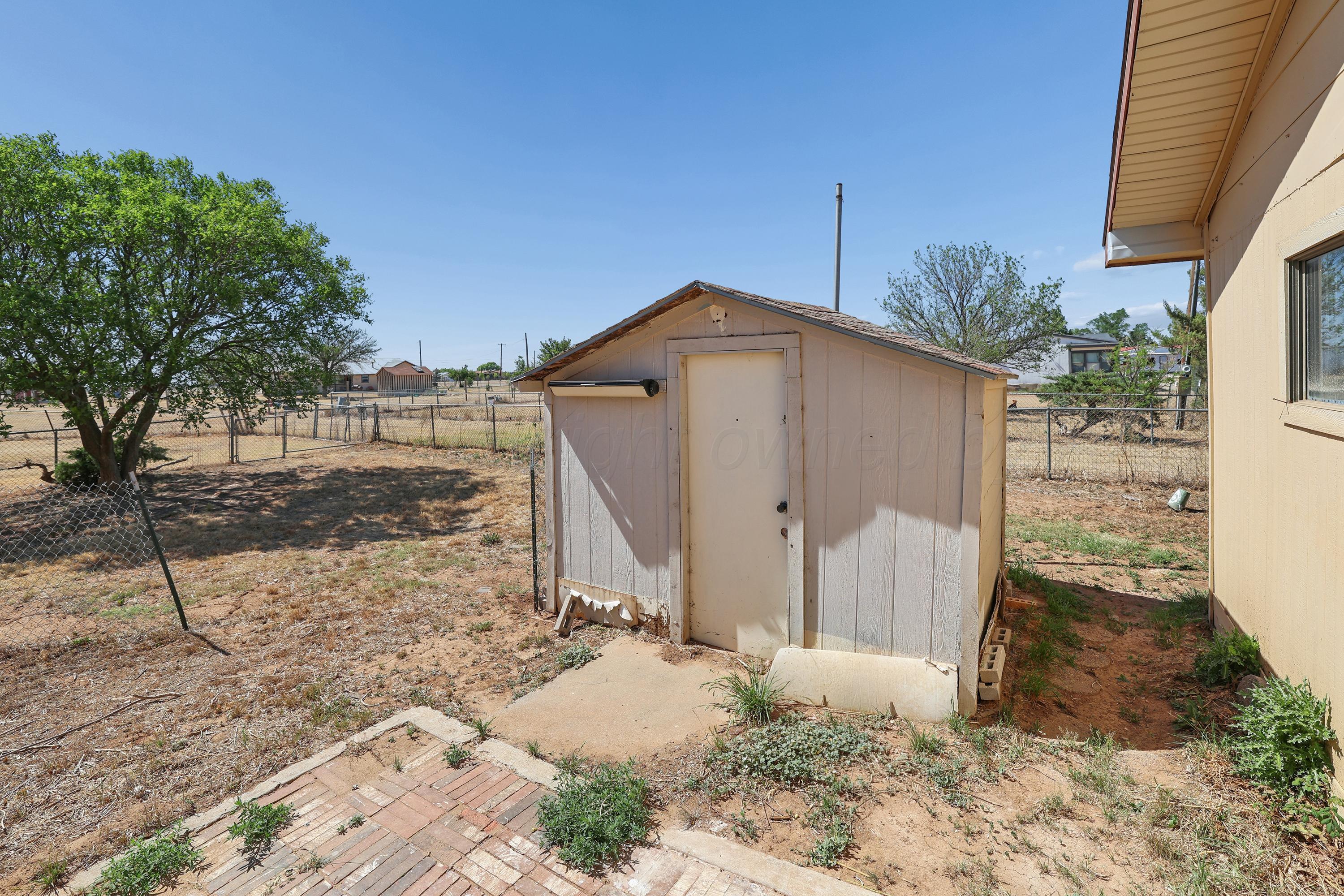 14200 Savannah Road Amarillo, TX 79118 - Photo 29 of 34 a front view of a house with a yard