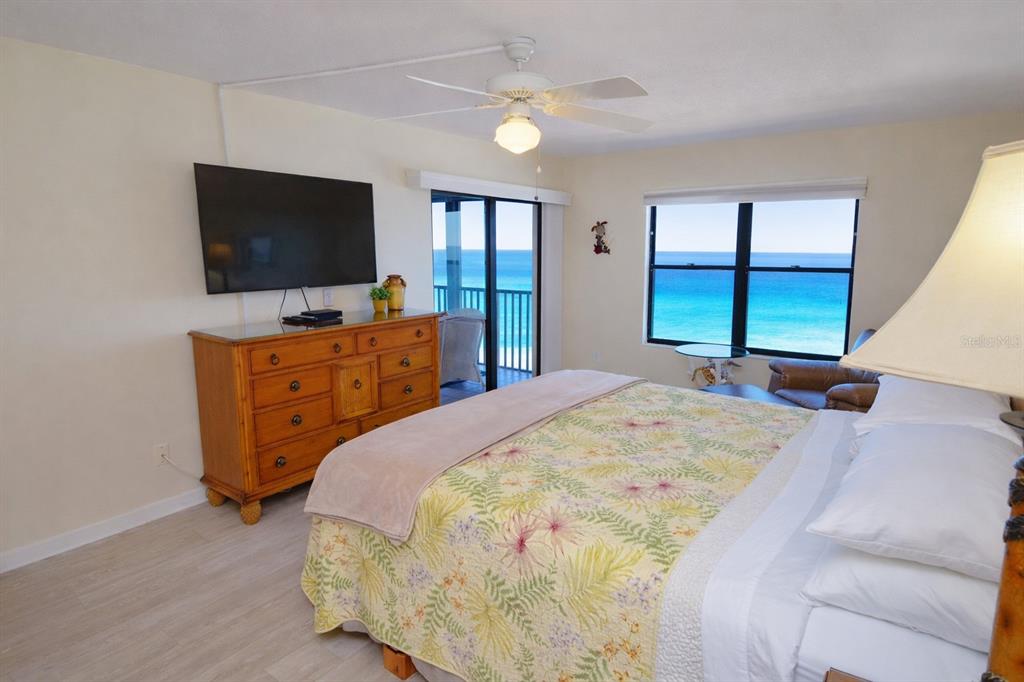 900 Gulf Boulevard, Unit 907 Indian Rocks Beach, FL 33785 - Photo 32 of 88 a spacious bedroom with a bed and a flat screen tv