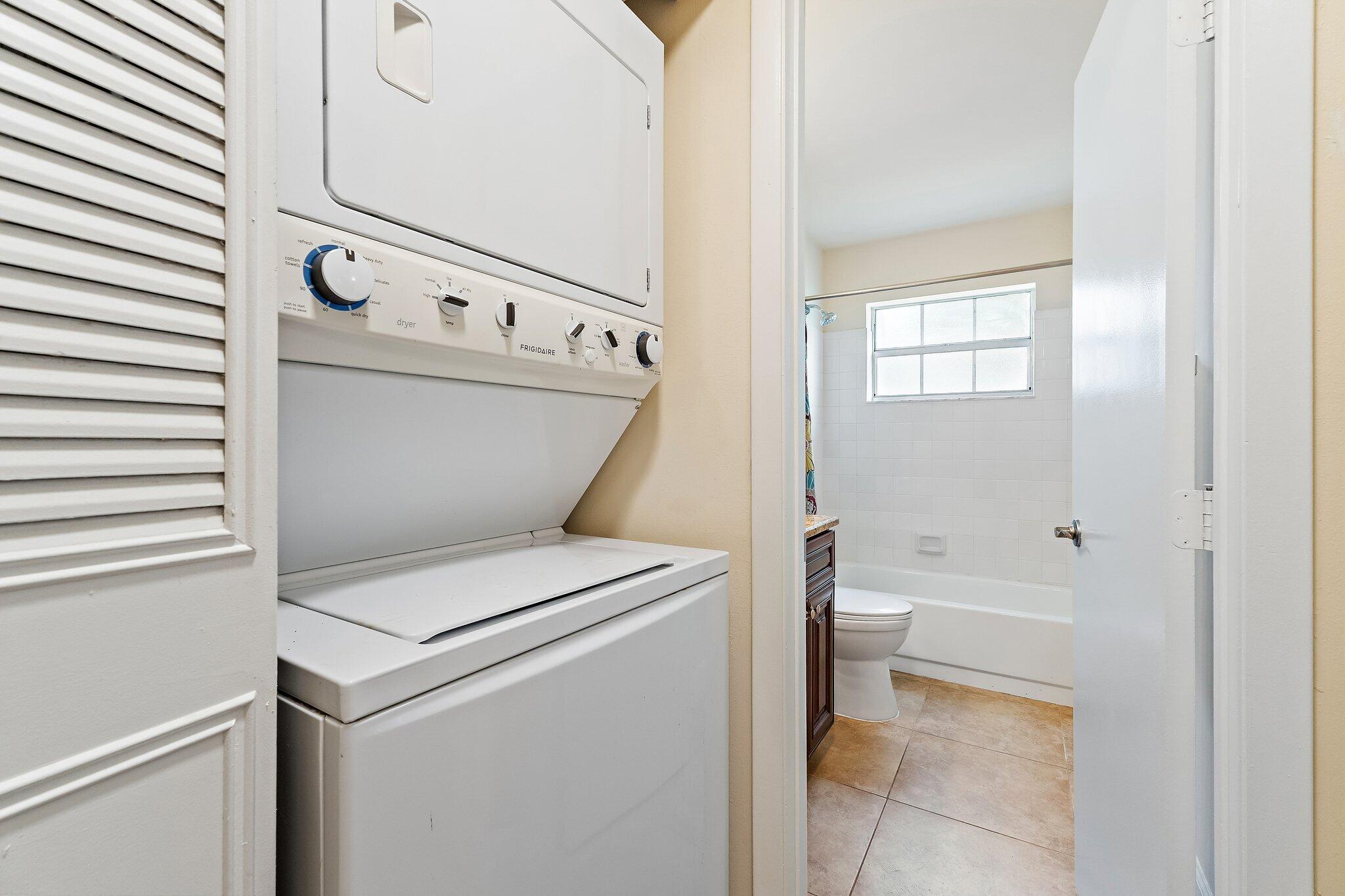 109 Doe Trail Jupiter, FL 33458 - Photo 21 of 26 a utility room with dryer and washer