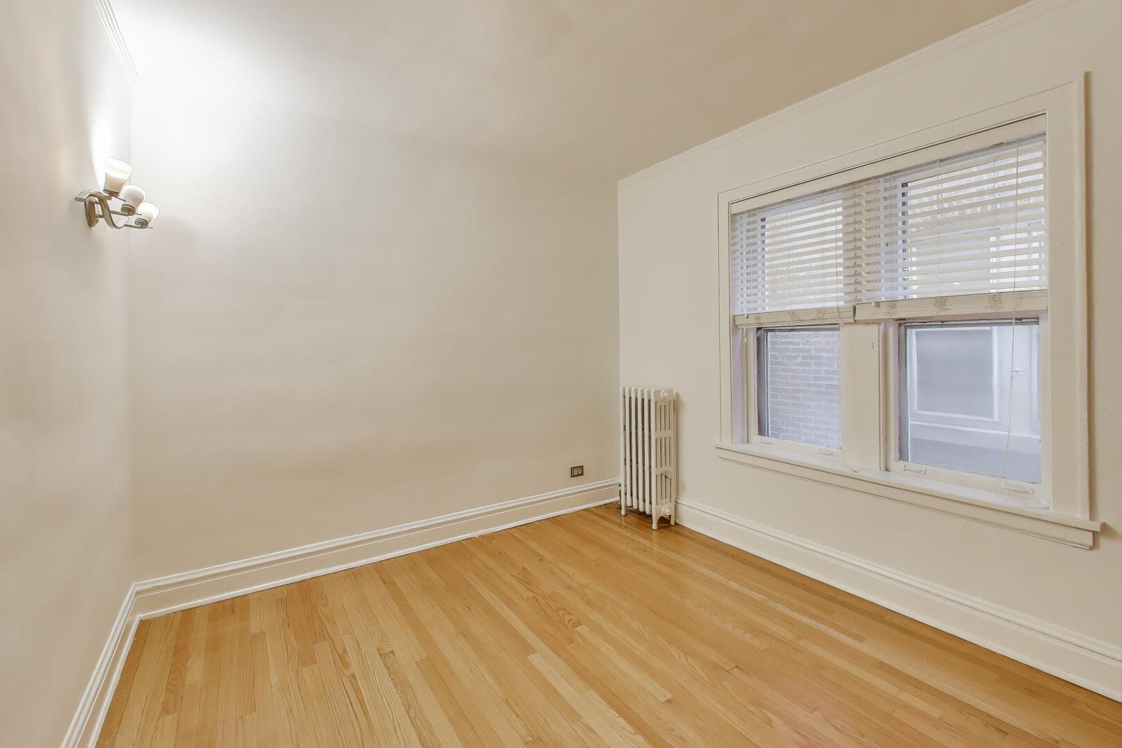 7346 Lake Street, Unit 2W River Forest, IL 60305 - Photo 11 of 30 a view of empty room with wooden floor and fan