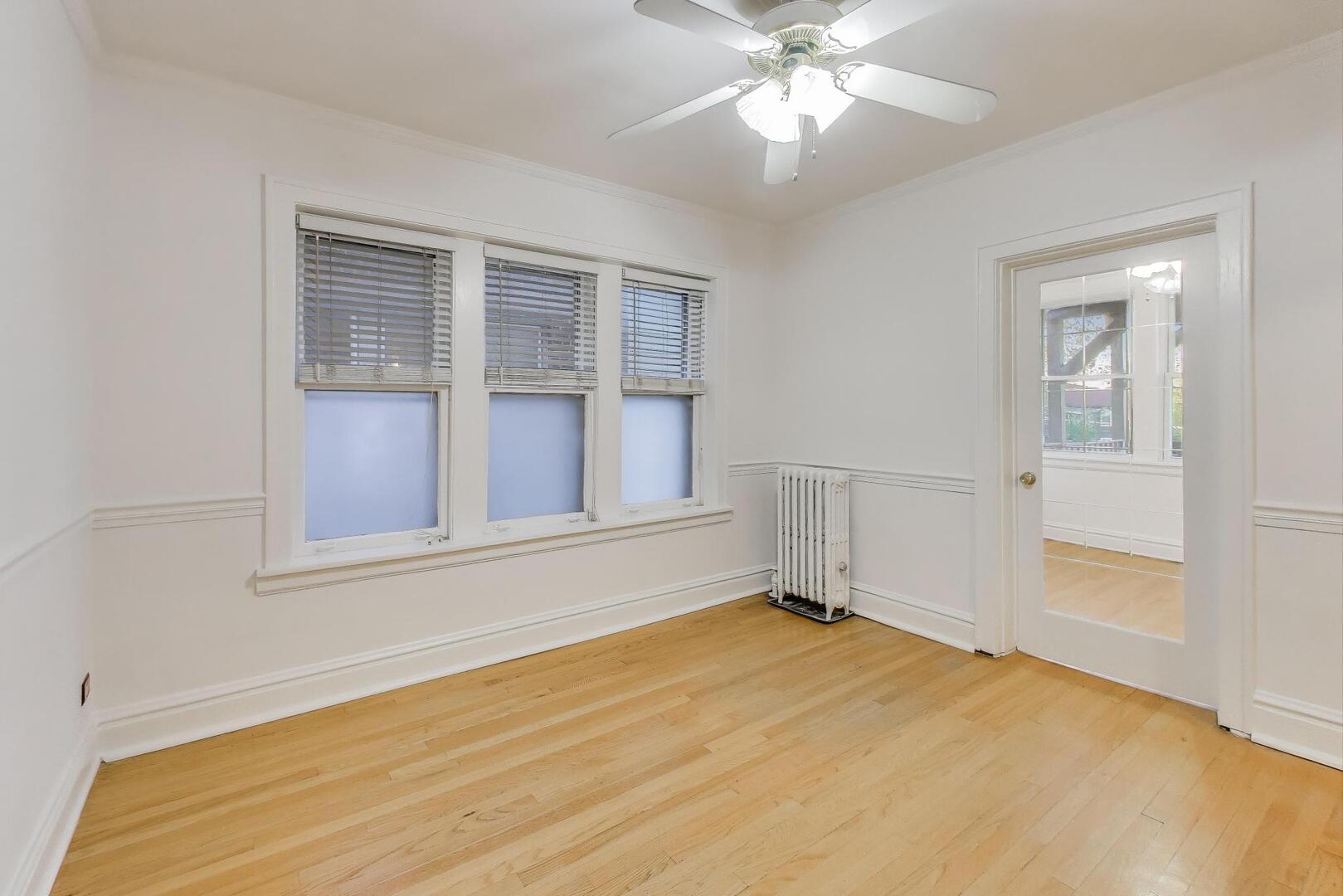 7346 Lake Street, Unit 2W River Forest, IL 60305 - Photo 15 of 30 a view of an empty room with wooden floor and a window