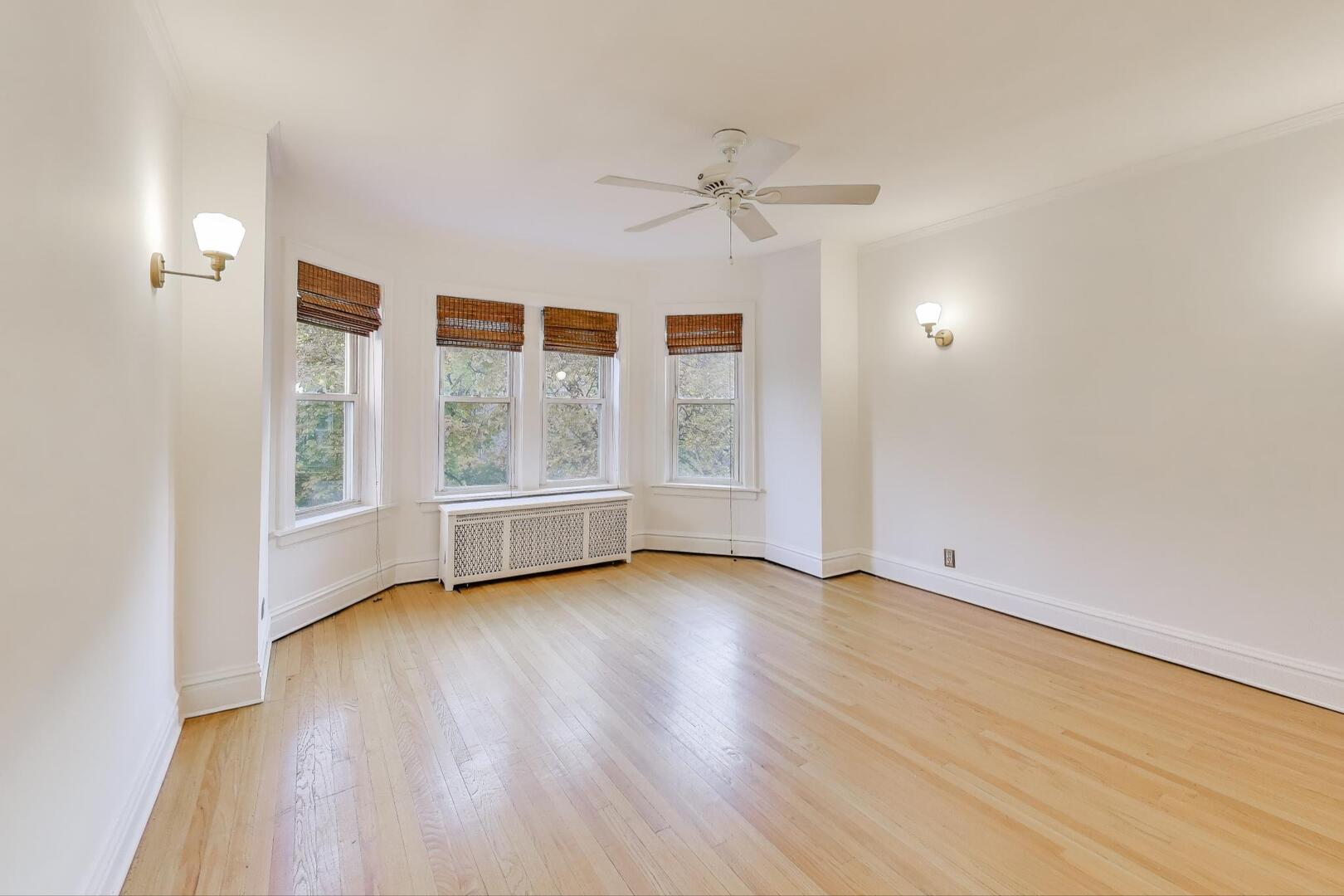 7346 Lake Street, Unit 2W River Forest, IL 60305 - Photo 3 of 30 an empty room with wooden floor fan and windows