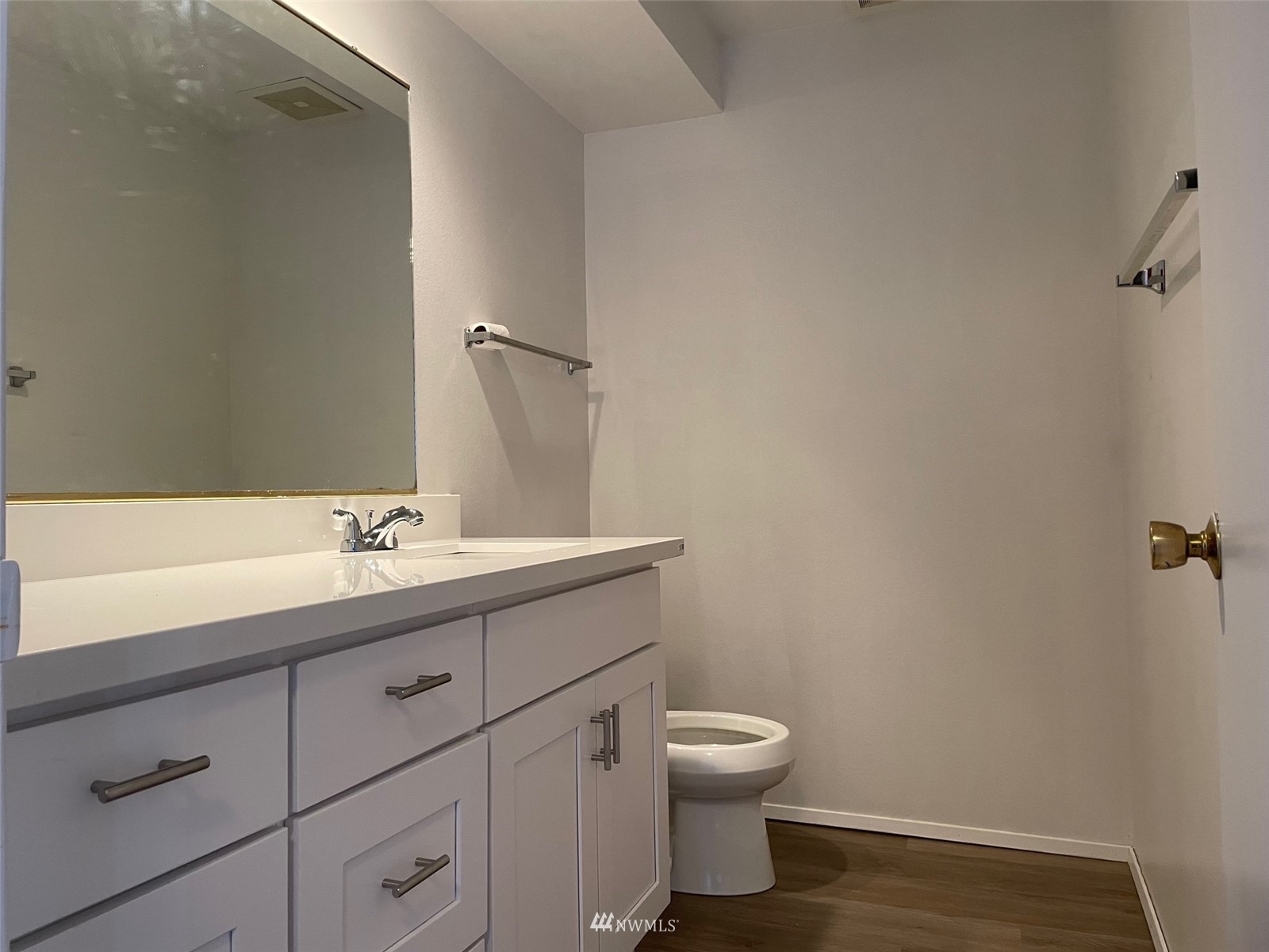 1606 Aberdeen Court Southeast Renton, WA 98055 - Photo 4 of 20 a bathroom with a toilet sink and mirror