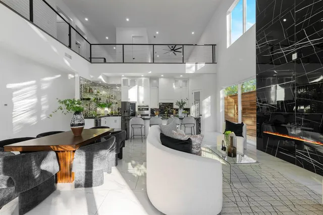 a lobby with furniture and potted plants