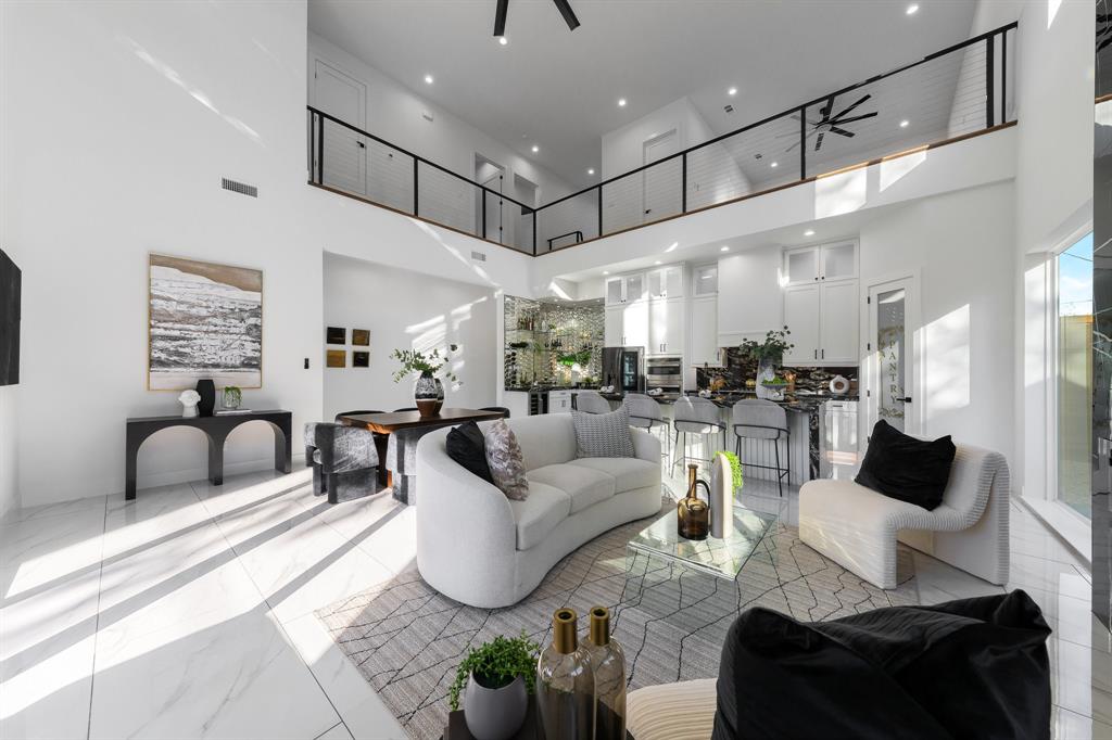 3351 Sylvan Avenue Dallas, TX 75212 - Photo 16 of 40 a living room with furniture kitchen view and a chandelier