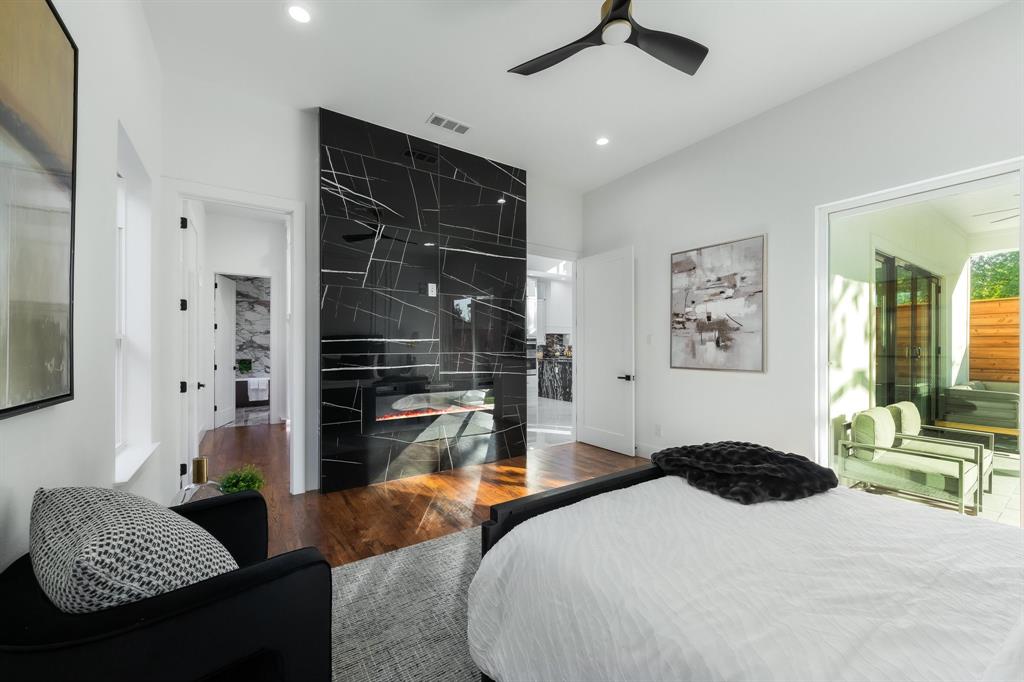 3351 Sylvan Avenue Dallas, TX 75212 - Photo 22 of 40 a bedroom with a bed and wooden floor