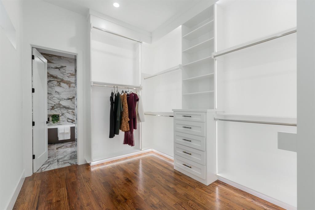 3351 Sylvan Avenue Dallas, TX 75212 - Photo 23 of 40 a view of walk in closet with clothes and shoes