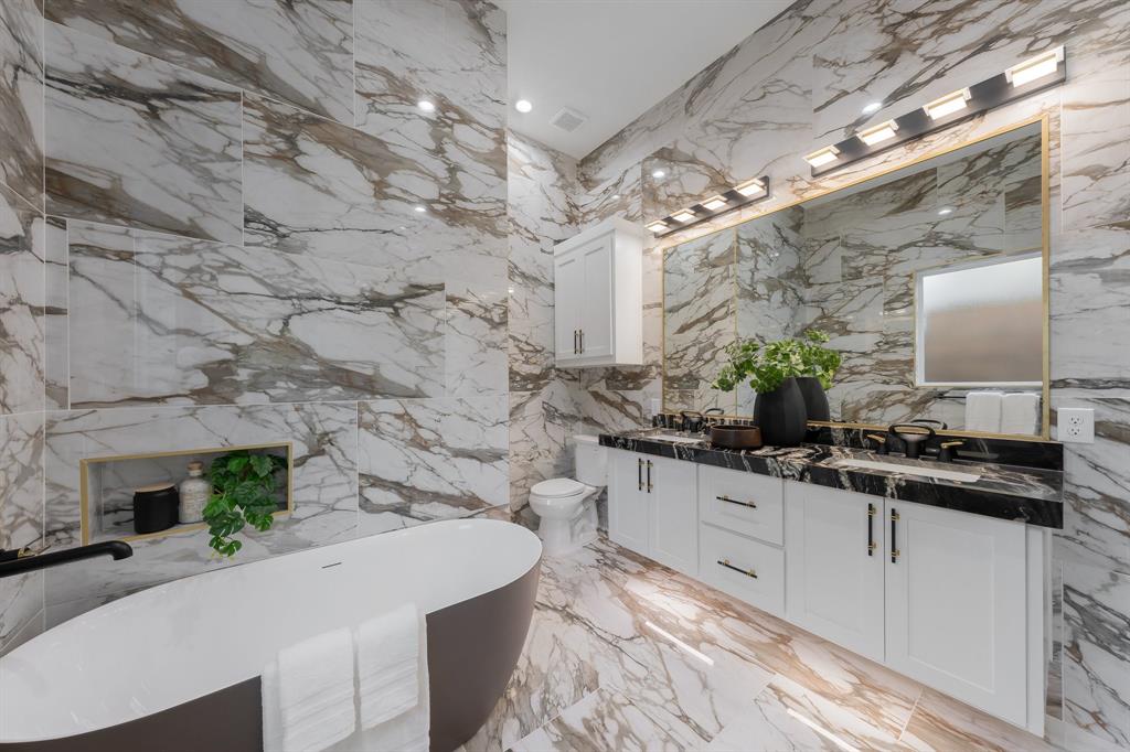 3351 Sylvan Avenue Dallas, TX 75212 - Photo 24 of 40 a large white kitchen with a sink and a stove